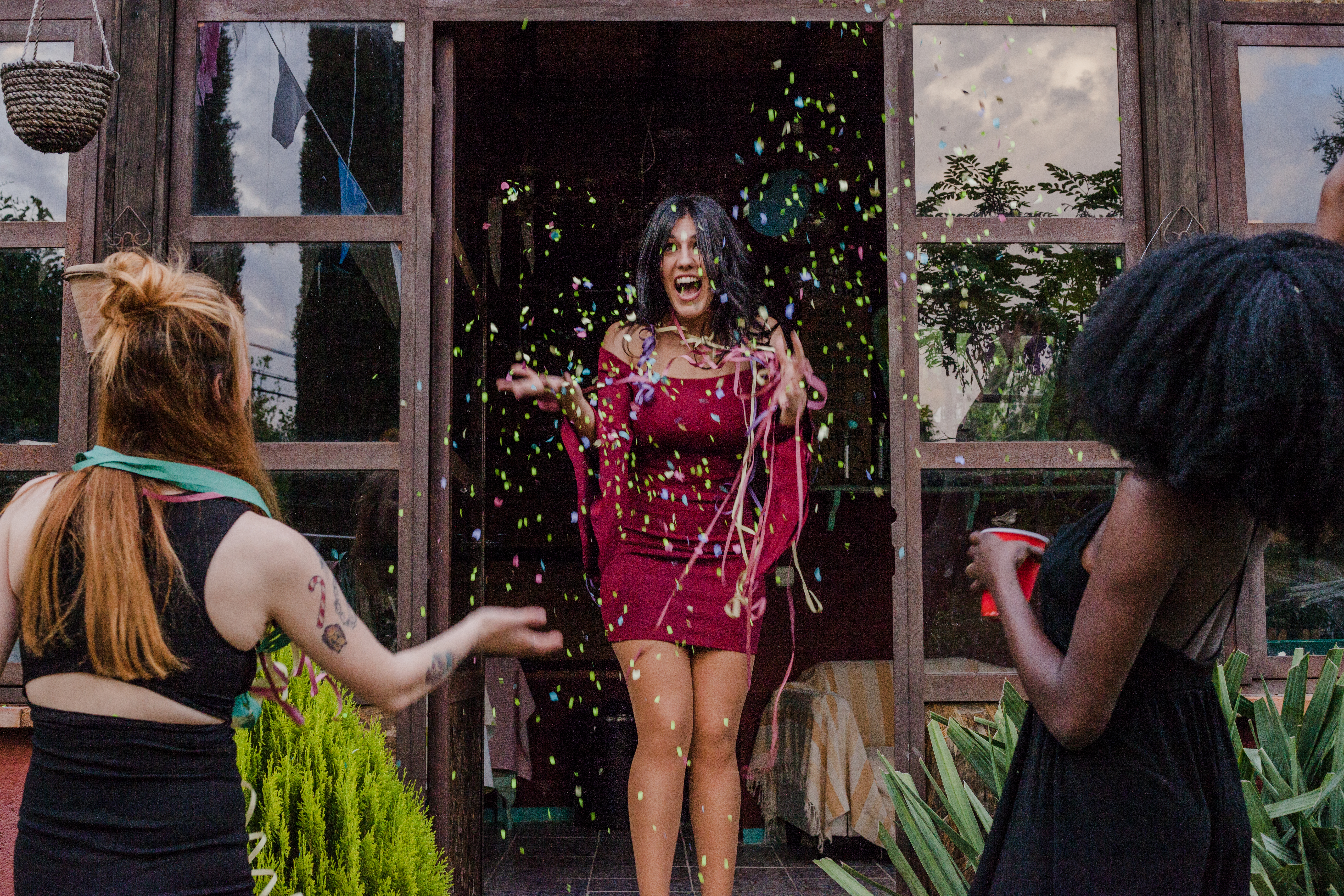 High angle bride and groom posing with flowers