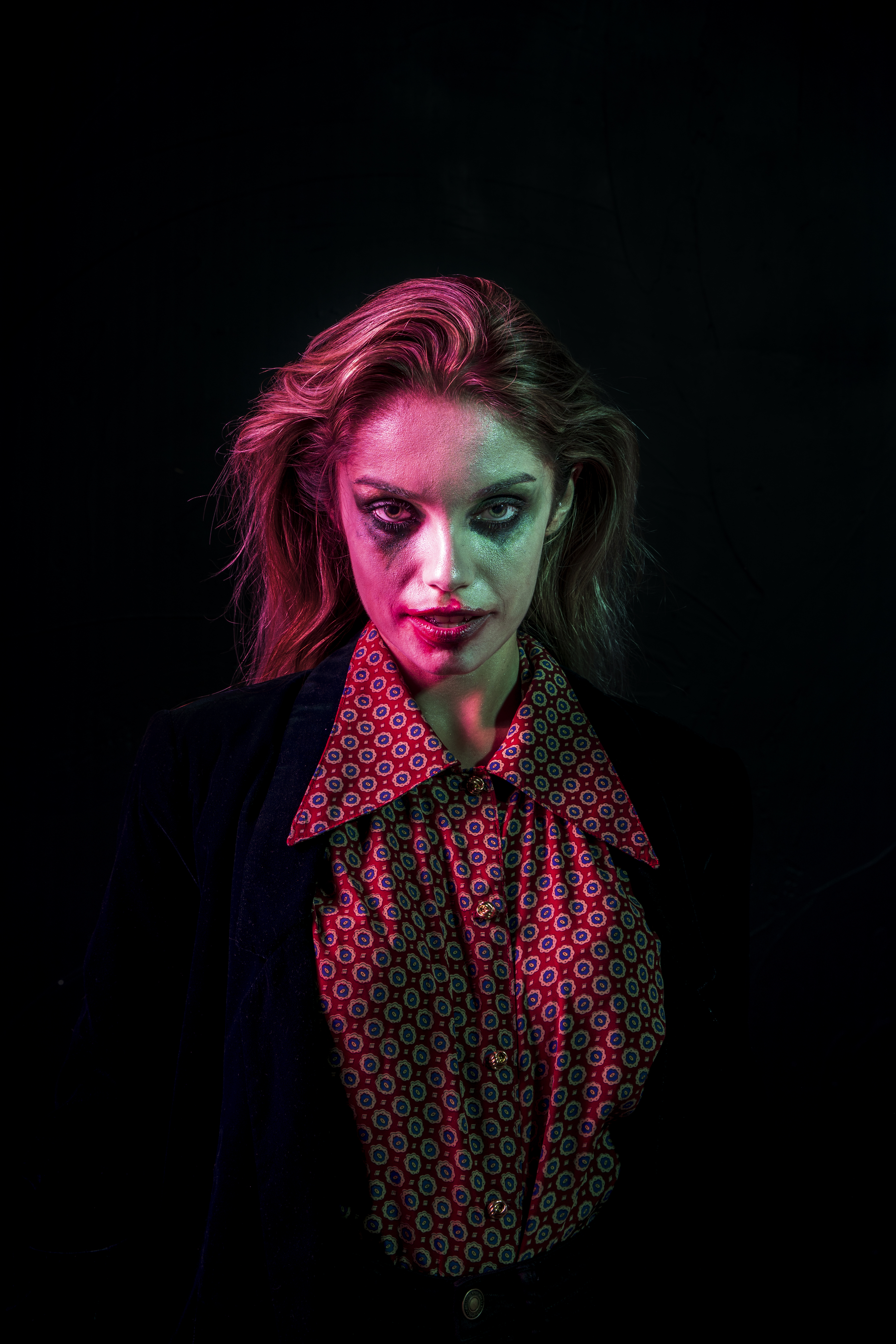 High angle bride and groom posing with flowers